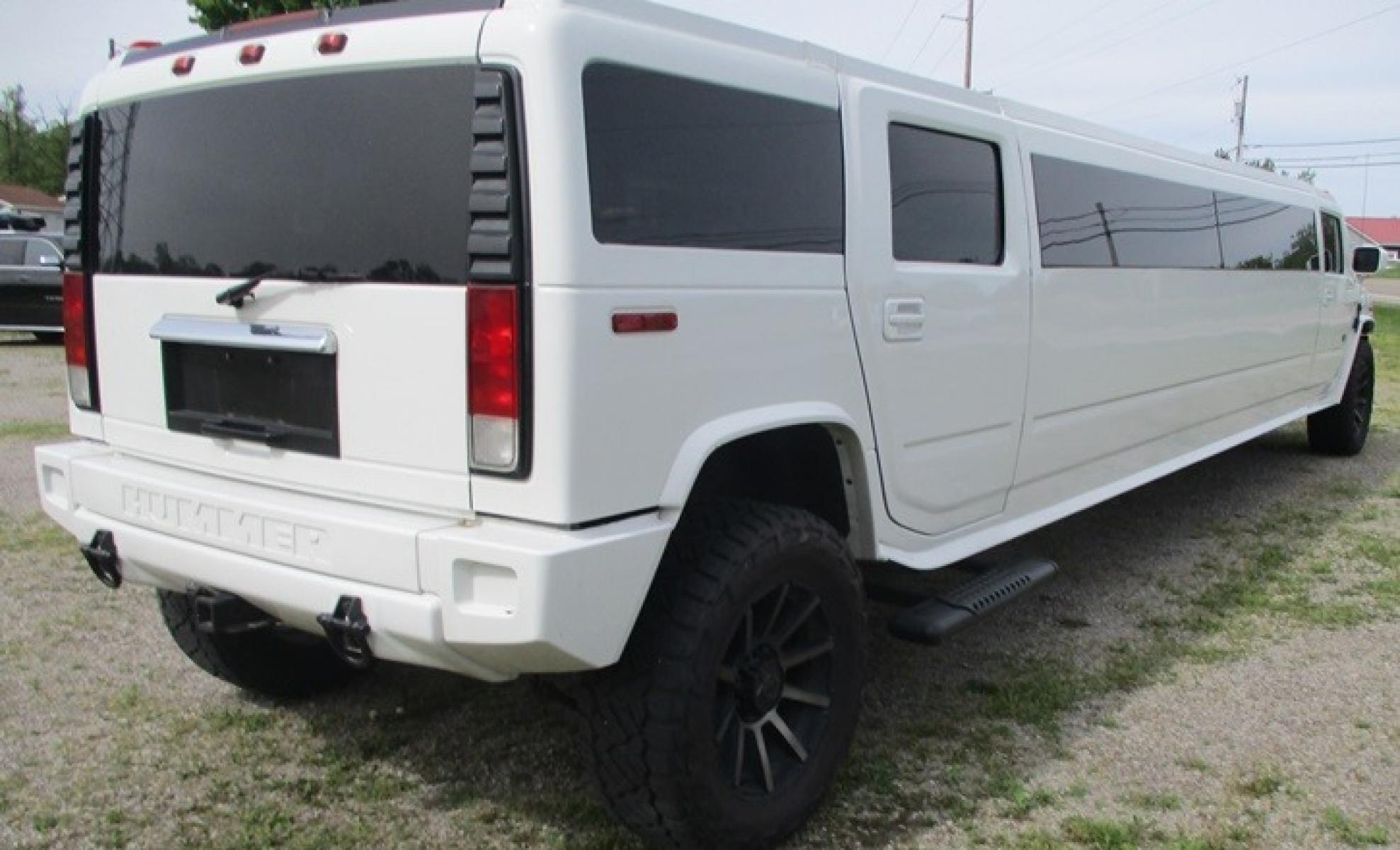 2005 White /White/Black Hummer H2 , located at 1725 US-68 N, Bellefontaine, OH, 43311, (937) 592-5466, 40.387783, -83.752388 - 2005 Hummer H2 175" SUV VIP Limousine, White w/White/black leather interior, Front/Rear Ait, Flat Screens, AM/FM/CD reconditioned Interior, LOADED - Photo #1